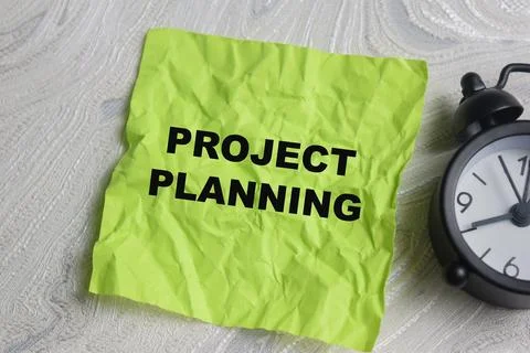Concept of project planning write on sticky notes isolated on Wooden Table. Stock Photos