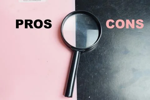 Concept of pros or cons write on color background with magnifying glass. Stock Photos