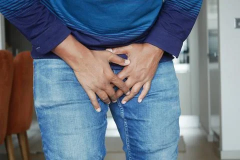 The concept of prostate and bladder problem, crotch pain of a young person Stock Photos