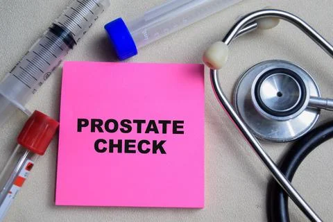 Concept of Prostate check write on sticky notes isolated on Wooden Table. Stock Photos