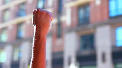 Concept of protests and racial riots, a black hand against the backdrop of the Stock Footage 143342535