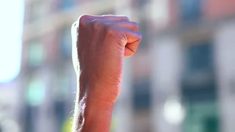 Concept of protests and racial riots, a black hand against the backdrop of the Stock Footage 143346592