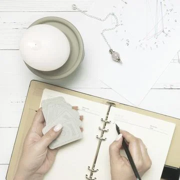 Concept of psychic advisor or ways of divination with cards. Stock Photos
