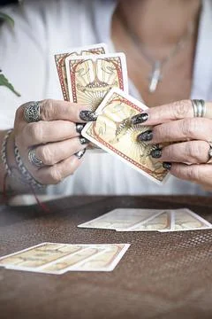 Concept of psychic advisor or ways of divination with cards. Stock Photos
