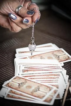 Concept of psychic advisor or ways of divination with cards. Stock Photos