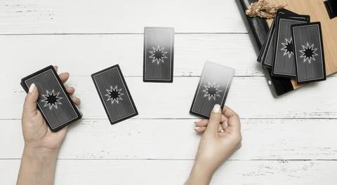 Concept of psychic advisor or ways of divination with cards. Stock Photos