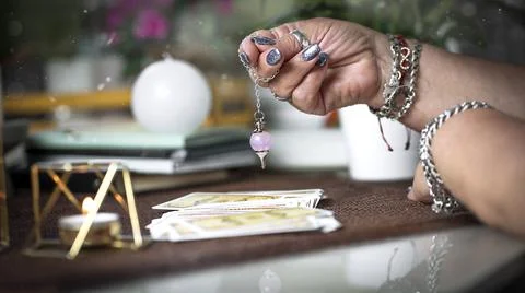 Concept of psychic advisor or ways of divination with cards. Stock Photos