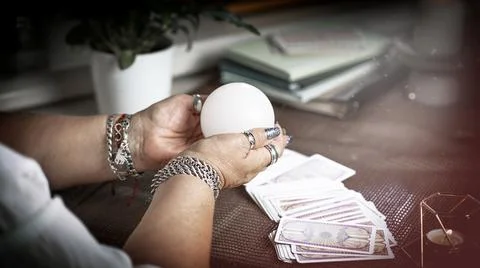 Concept of psychic advisor or ways of divination with cards. Stock Photos