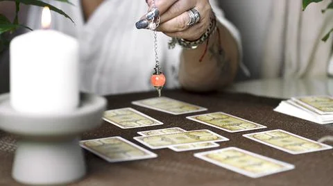 Concept of psychic advisor or ways of divination with cards. Stock Photos