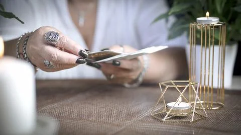 Concept of psychic advisor or ways of divination with cards. Stock Photos