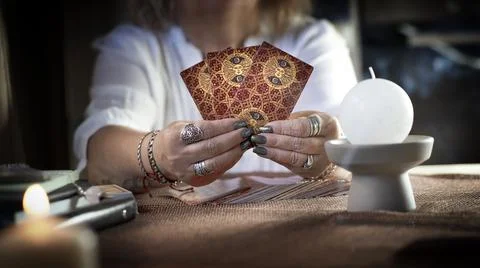 Concept of psychic advisor or ways of divination with cards. Stock Photos