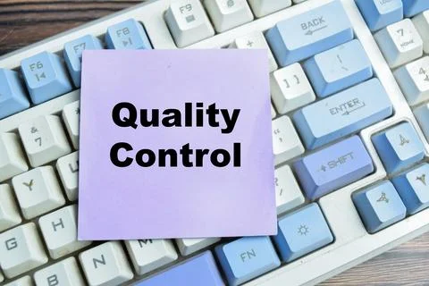 Concept of quality control write on sticky notes isolated on Wooden Table. Foto stock