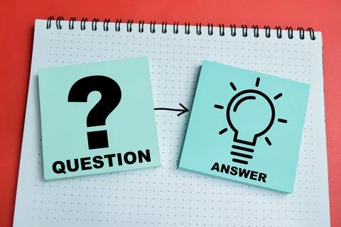 Concept of question and answer write on sticky notes isolated on table. Stock Photos