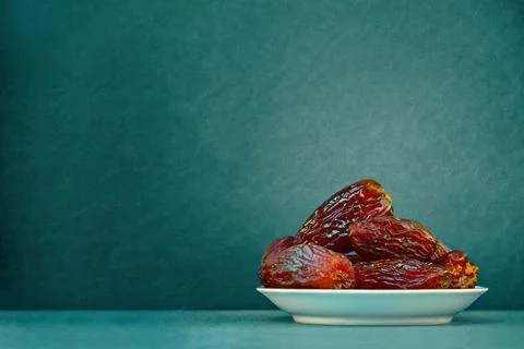 The Concept Of Ramadan. Dates on a green background. Place for text. Stock Photos