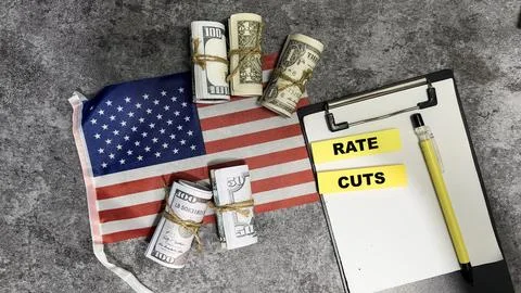 Concept of Rate Cuts write on sticky notes and Flag of the United States Stock Photos
