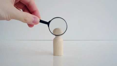 The concept of recruiting employees to work with magnifying glass Stock Footage 142753941