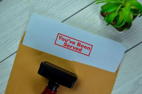 Concept of Red Handle Rubber Stamper and You've Been Served text Photos