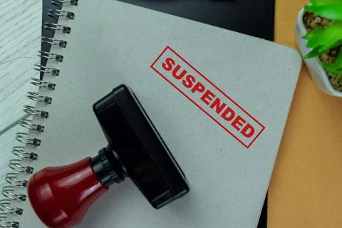 Concept of Red Handle Rubber Stamper and Suspended text Photos