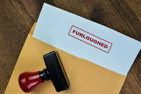 Concept of Red Handle Rubber Stamper and Furloughed text Photos