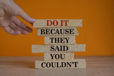 Concept red words Do it because they said you could not on brick blocks Stock Photos