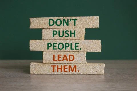 Concept red words Do not push people lead them on brick blocks. Stock Photos