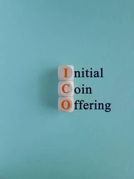 Concept red words ICO initial coin offering on beautiful wooden cubes. Stock Photos