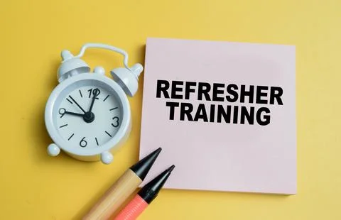 Concept of refresher training write on sticky notes isolated on table. Stock Photos