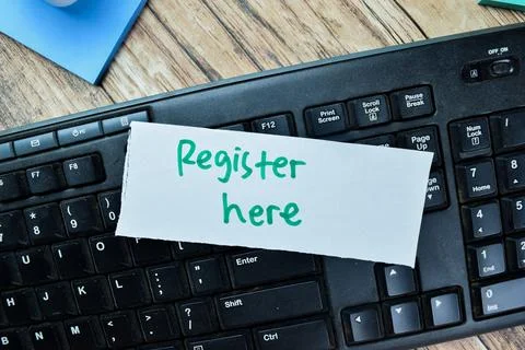 Concept of Register Here write on sticky notes with keywords Stock Photos