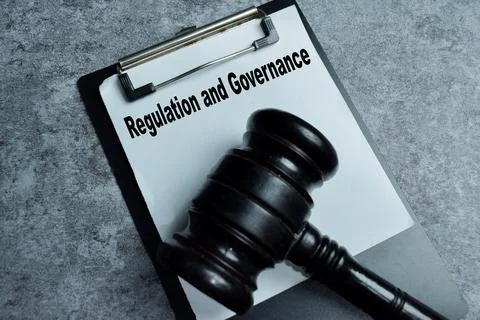 Concept of regulation and governance write on clipboard Stock Photos