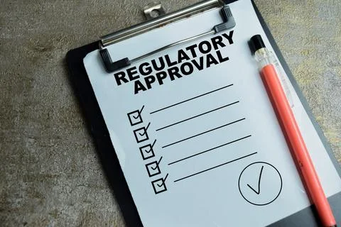 Concept of regulatory approval write on clipboard with compliance checklist. Stock Photos