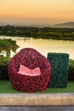 The concept of relax - Red sofa in the tea plantation Stock Photos