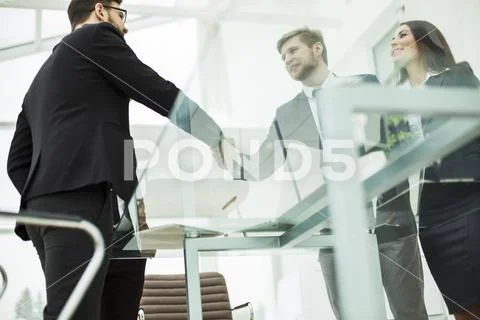Concept of a reliable partnership : a handshake of business partners on the Stock Photos