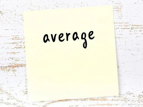 Concept of reminder about average. Yellow sticky sheet of paper on wooden wal Фото
