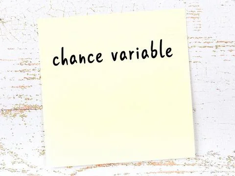 Concept of reminder about chance variable. Yellow sticky sheet of paper on wo Foto stock