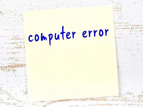 Concept of reminder about computer error. Yellow sticky sheet of paper on woo Stock Photos