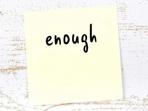 Concept of reminder about enough. Yellow sticky sheet of paper on wooden wall Stock Illustration