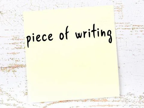Concept of reminder about piece of writing. Yellow sticky sheet of paper on w 库存照片