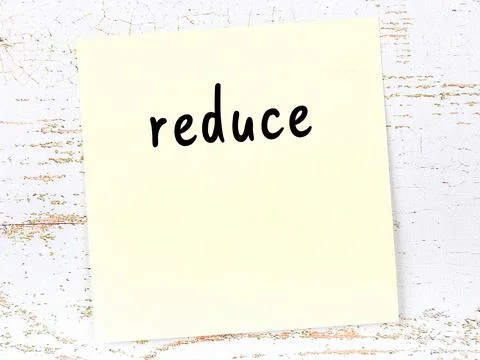 Concept of reminder about reduce. Yellow sticky sheet of paper on wooden wall Stock Illustration