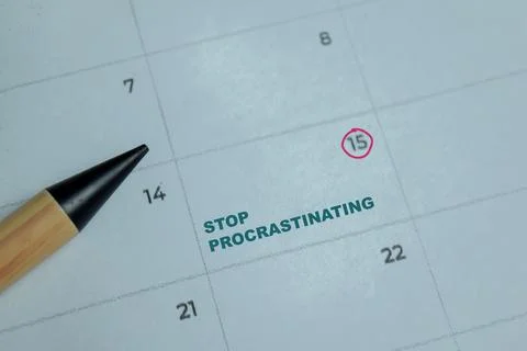 Concept reminder stop procrastinating in calendar Stock Photos