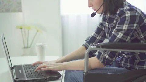 Concept remote work on the Internet, wheelchair, disabled person Stock Photos
