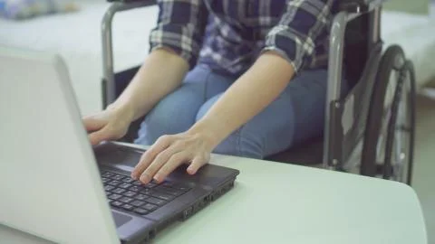 Concept remote work on the Internet, wheelchair, disabled person Stock Photos