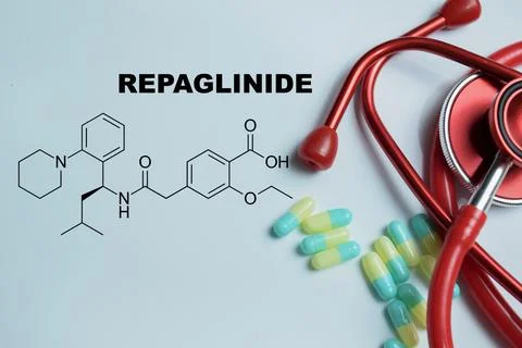 Concept of repaglinide antidiabetic write on book isolated on Wooden Table. Stock Photos