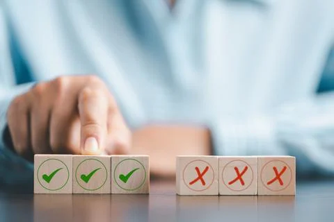 Concept of right or wrong mark on wooden cubic blocks. Business and lifesty.. Stock Photos