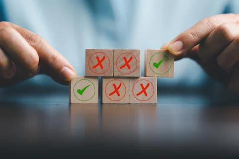 Concept of right or wrong mark on wooden cubic blocks. Business and lifesty.. Stock Photos