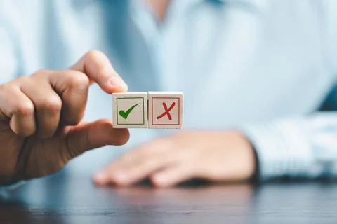 Concept of right or wrong mark on wooden cubic blocks. Business and lifesty.. Stock Photos