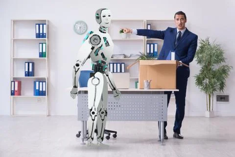 Concept of robots replacing humans in offices Stock Photos