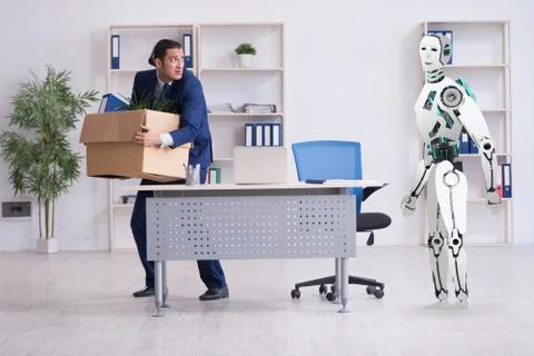 Concept of robots replacing humans in offices Stock Photos