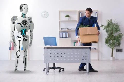 Concept of robots replacing humans in offices Stock Photos