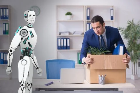 Concept of robots replacing humans in offices Stock Photos