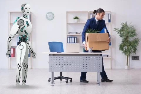 Concept of robots replacing humans in offices Stock Photos